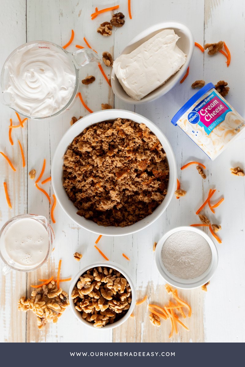 carrot cake cheesecake ingredients on wood background