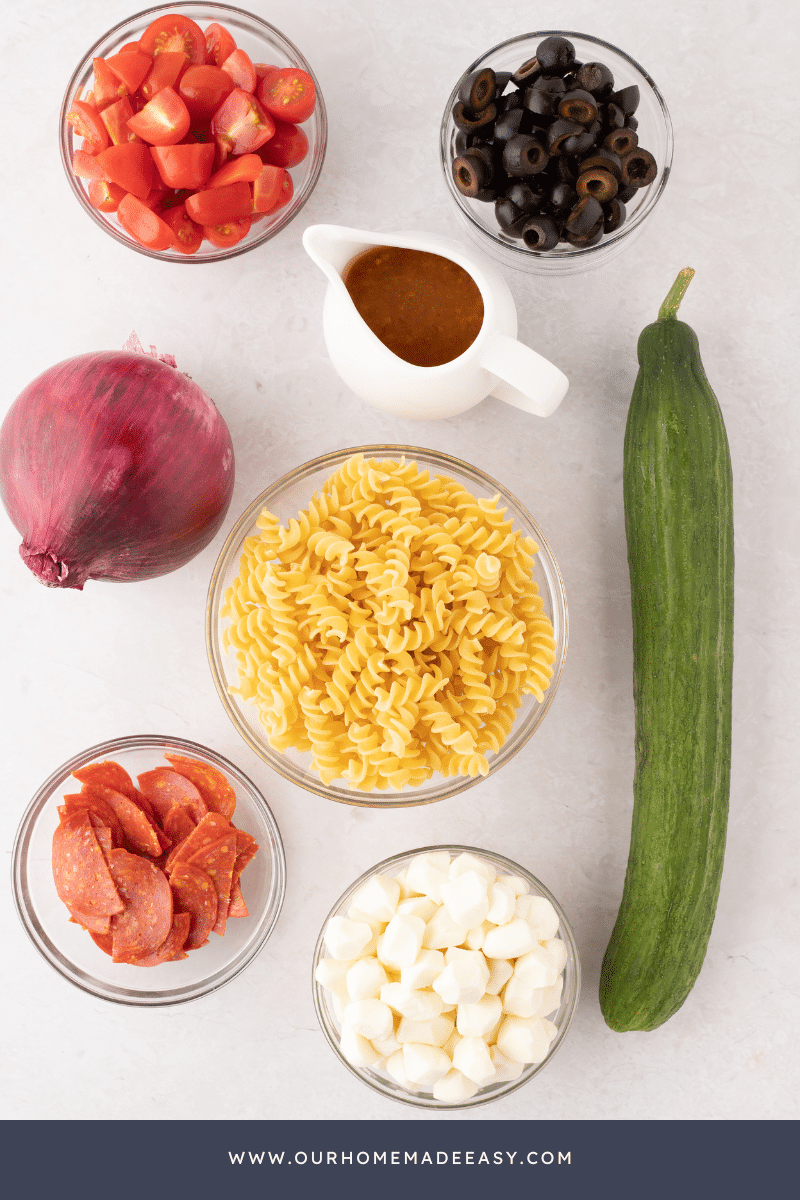 Zesty Italian Pasta Salad ingredients on countertop