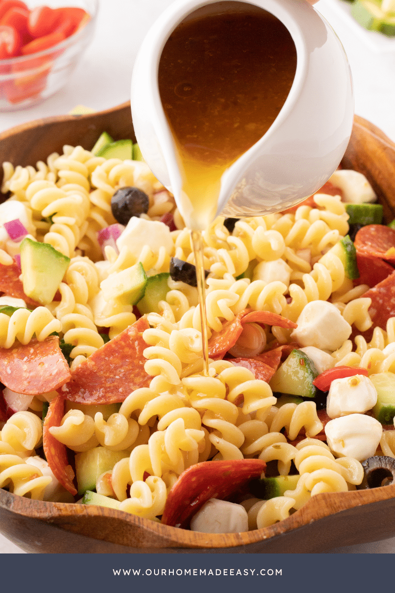 Italian dressing poured over rotini noodles