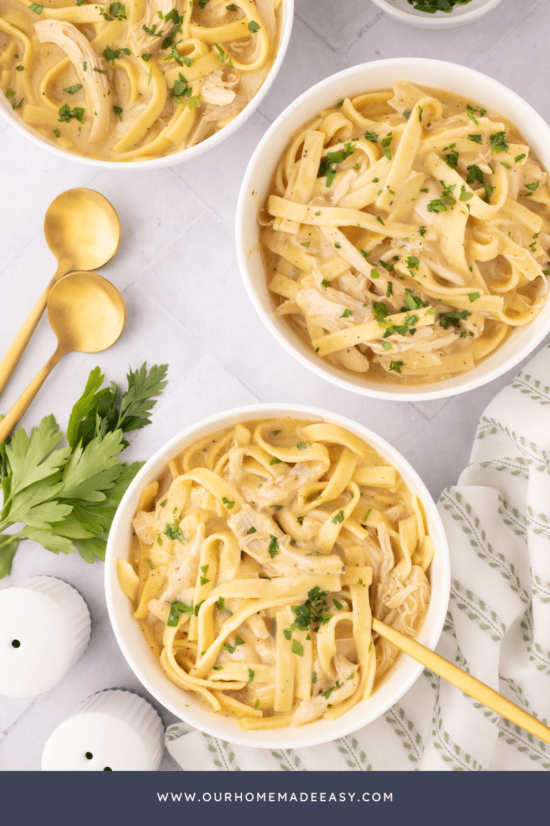 chicken and noodles in bowls with spoons