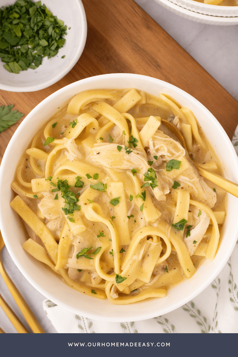 chicken and noodles dish on wood counter