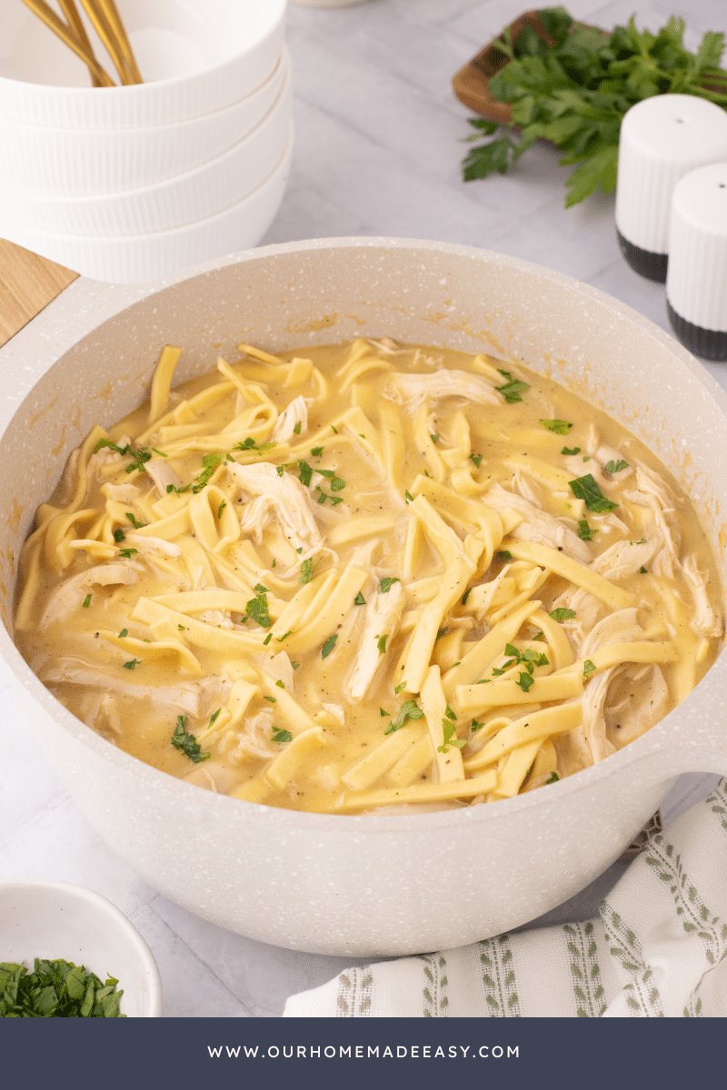 chicken and noodles noodles in cast iron pot