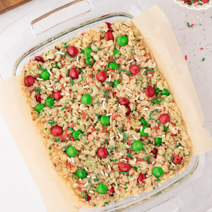 looking down on red and green rice Krispie treats in glass pan