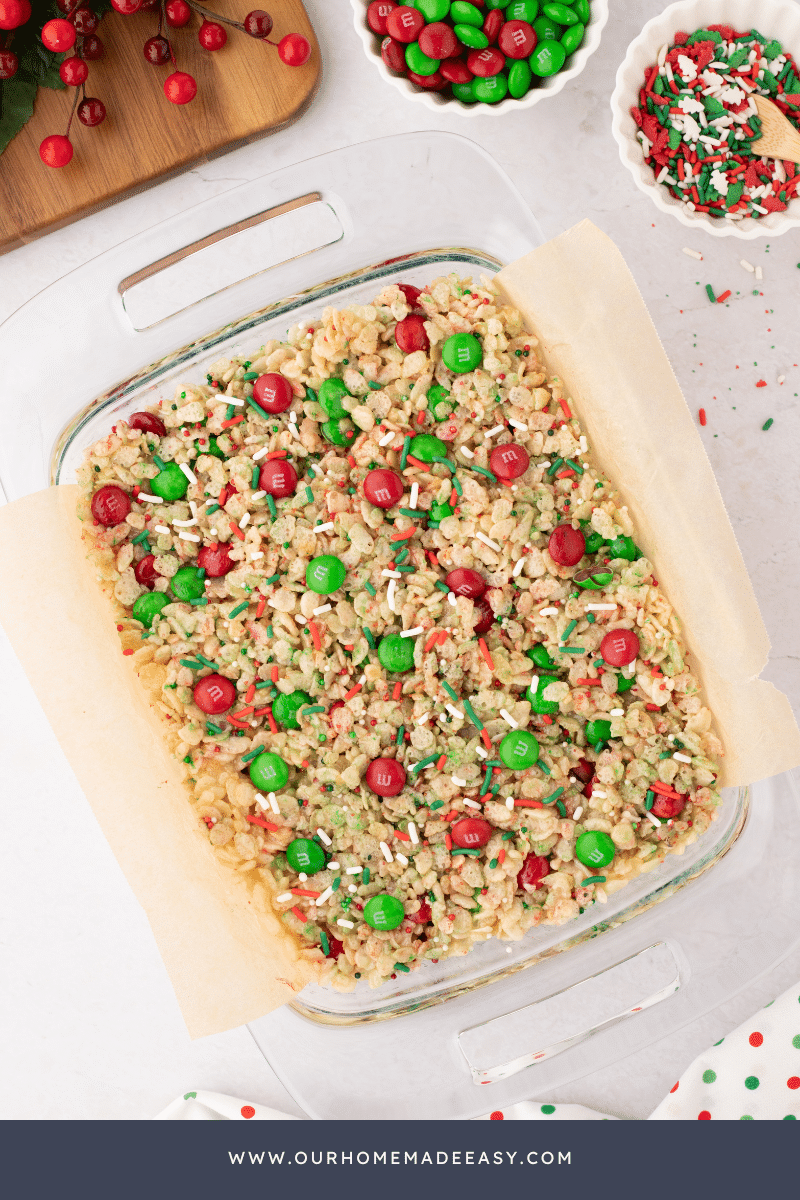 looking down on red and green rice Krispie treats in glass pan