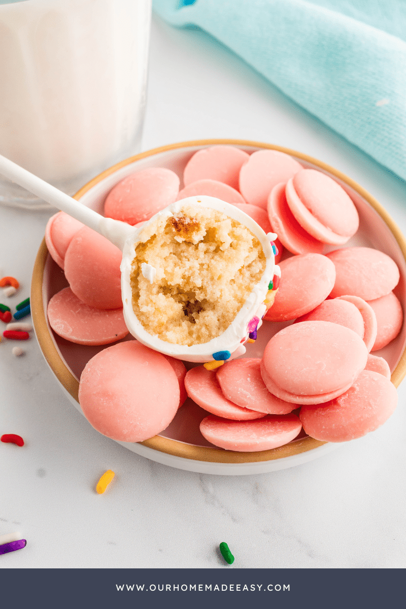 Easy Cake Pop Recipe lying over pink candy melts