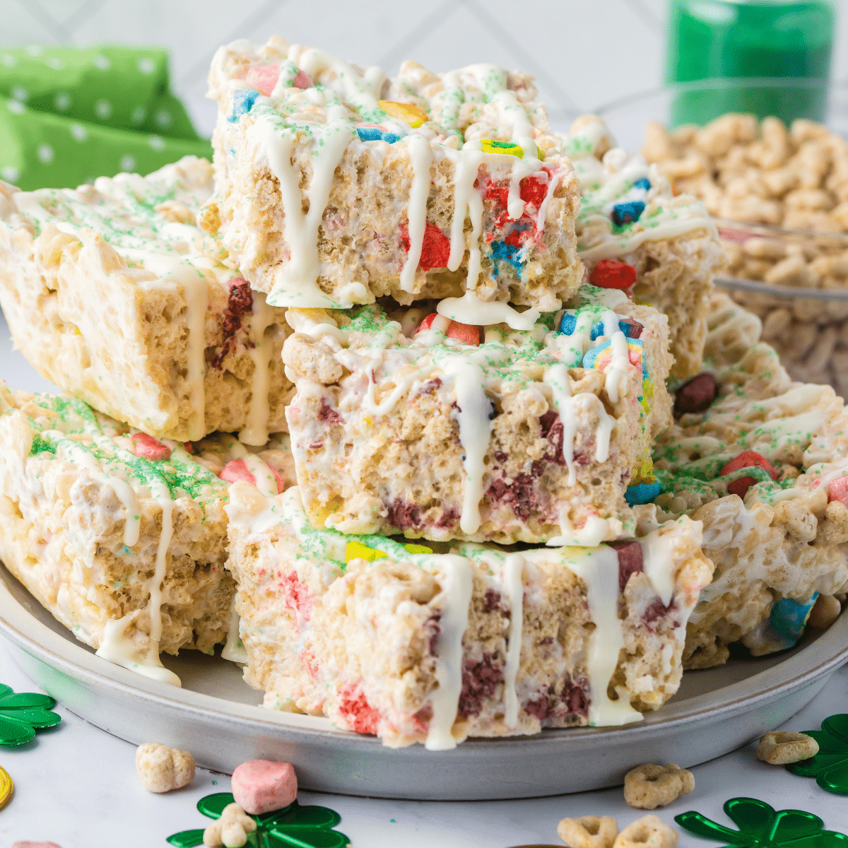 Lucky Charms Rice Krispie Treats cut and stacked on plate