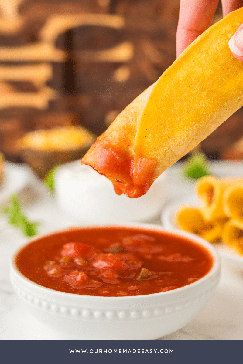 Bean and cheese taquitos dipped in salsa