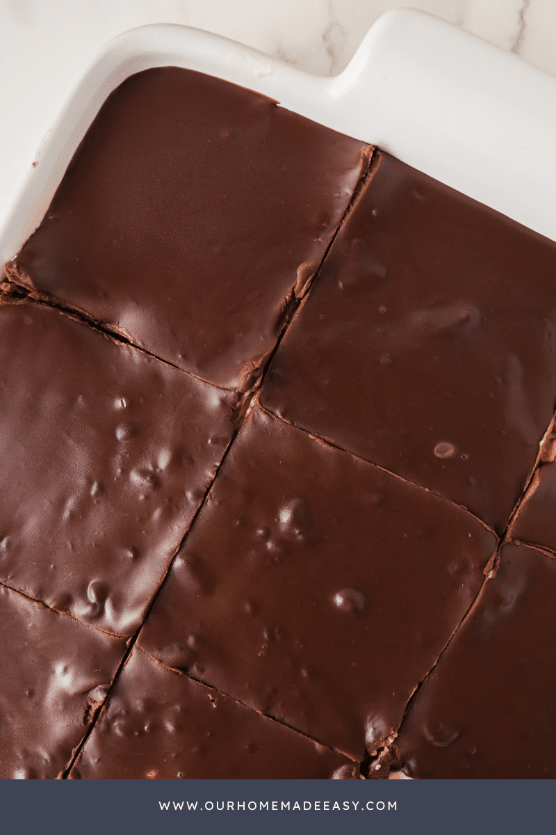 looking down at chocolate ganache frosting of Boston cream cake