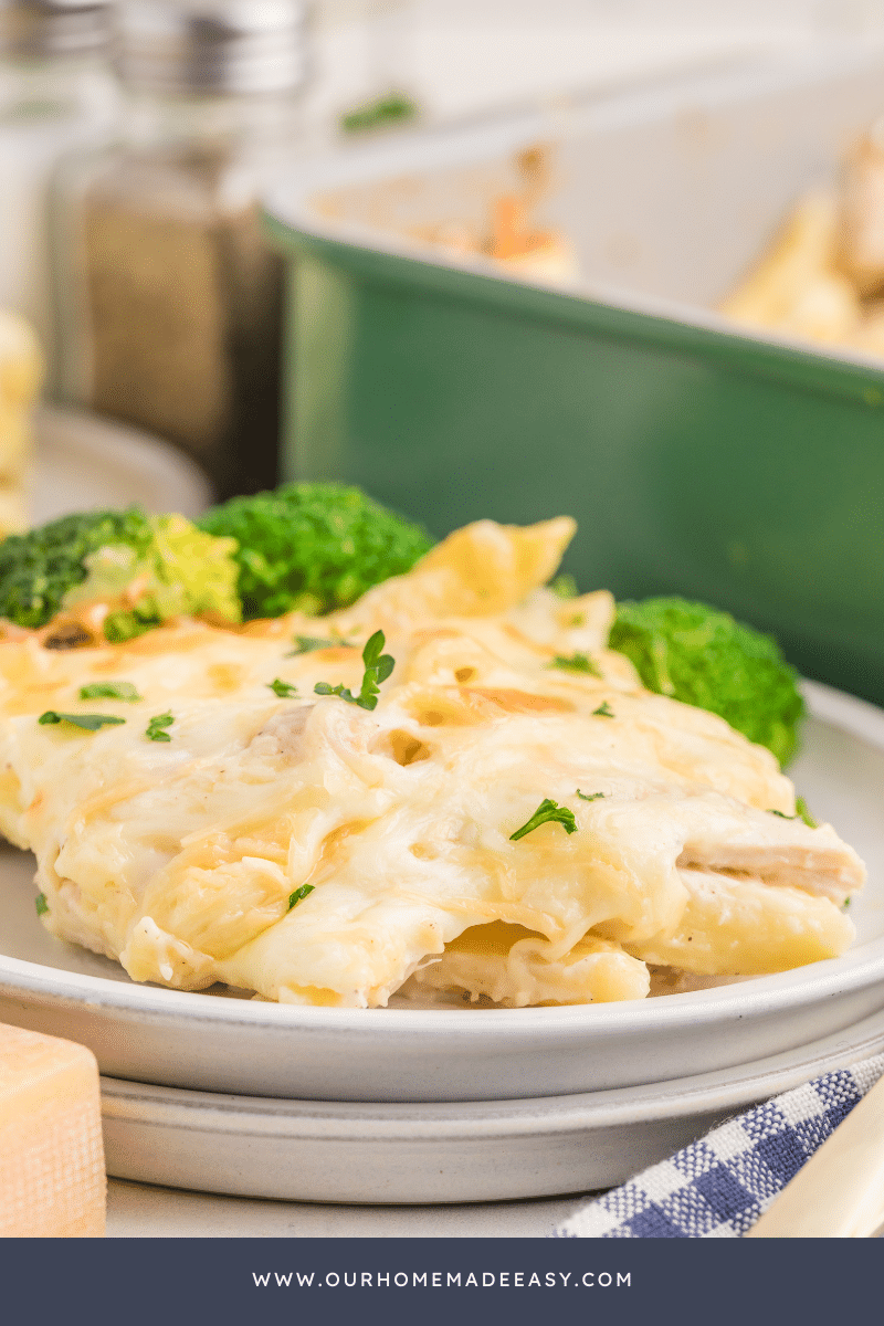 Chicken Alfredo casserole on plate with broccoli 