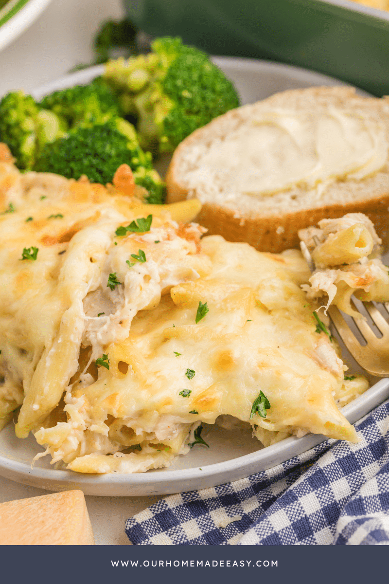 Chicken alfredo casserole cut on plate with fork