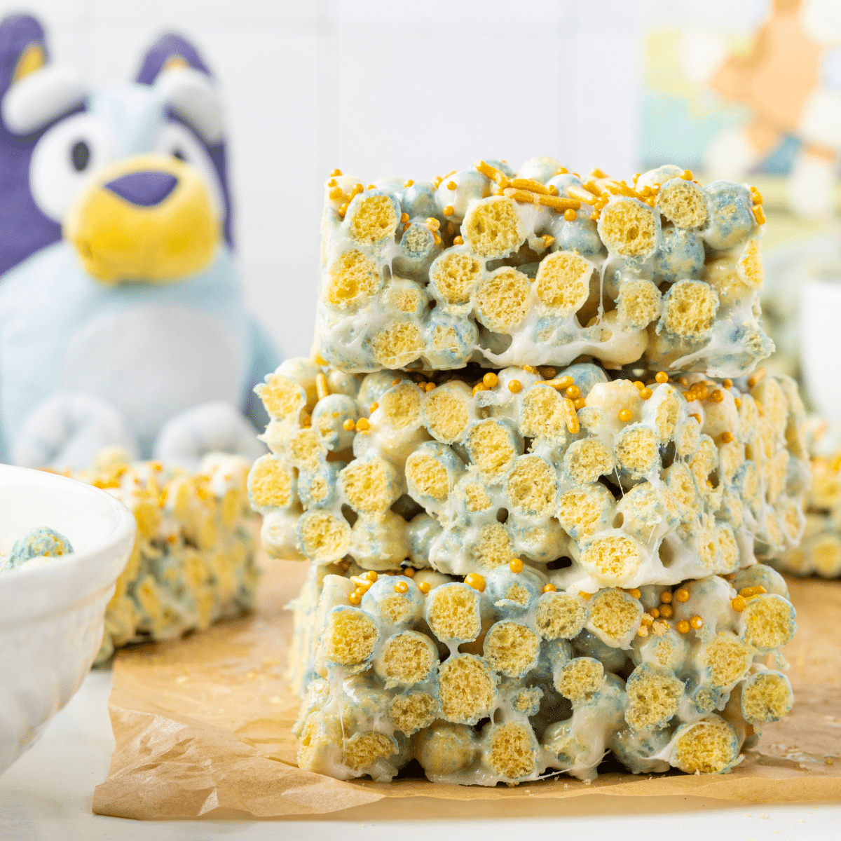 Bluey Cereal Bars stacked on wood cutting board