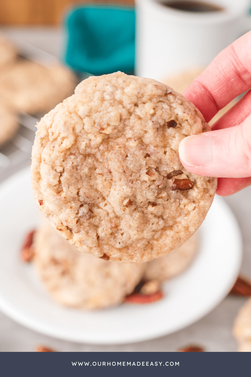 person holding the butter pecan cookie