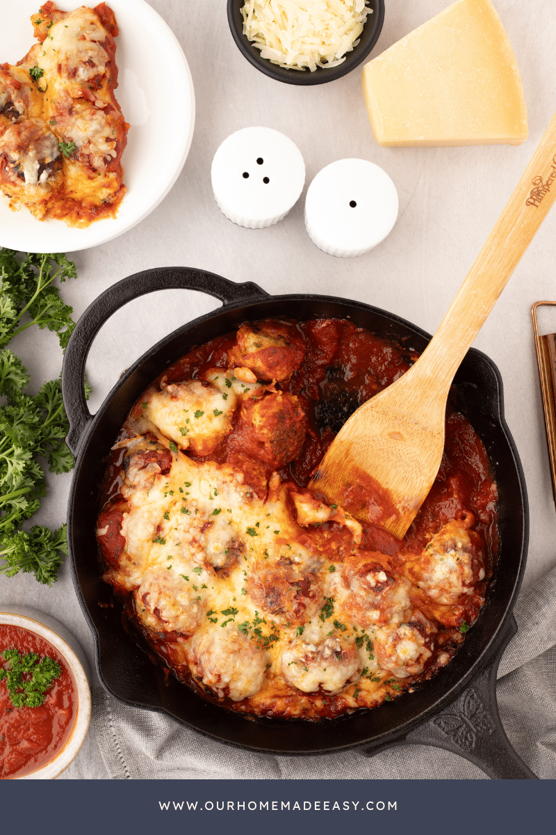 cast iron skillet with Italian dish and wooden spoon