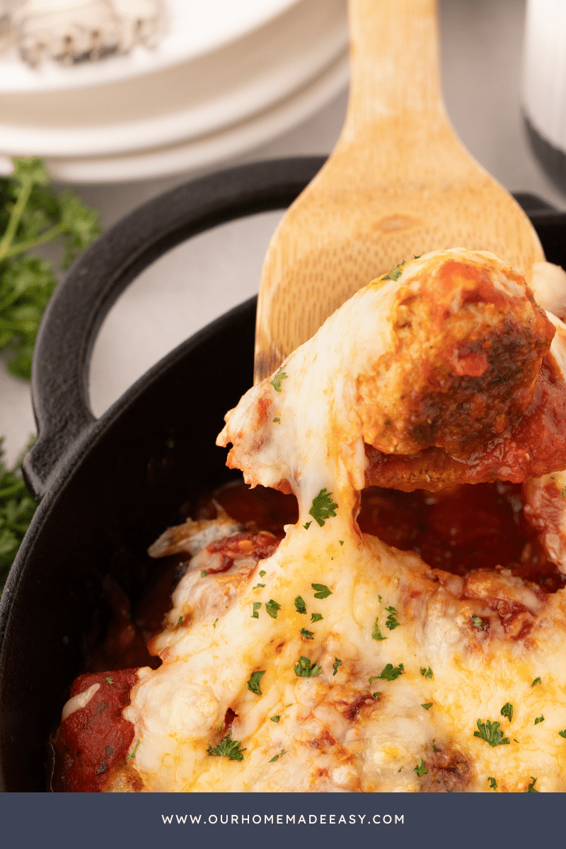 chicken parmesan meatball on wooden spoon