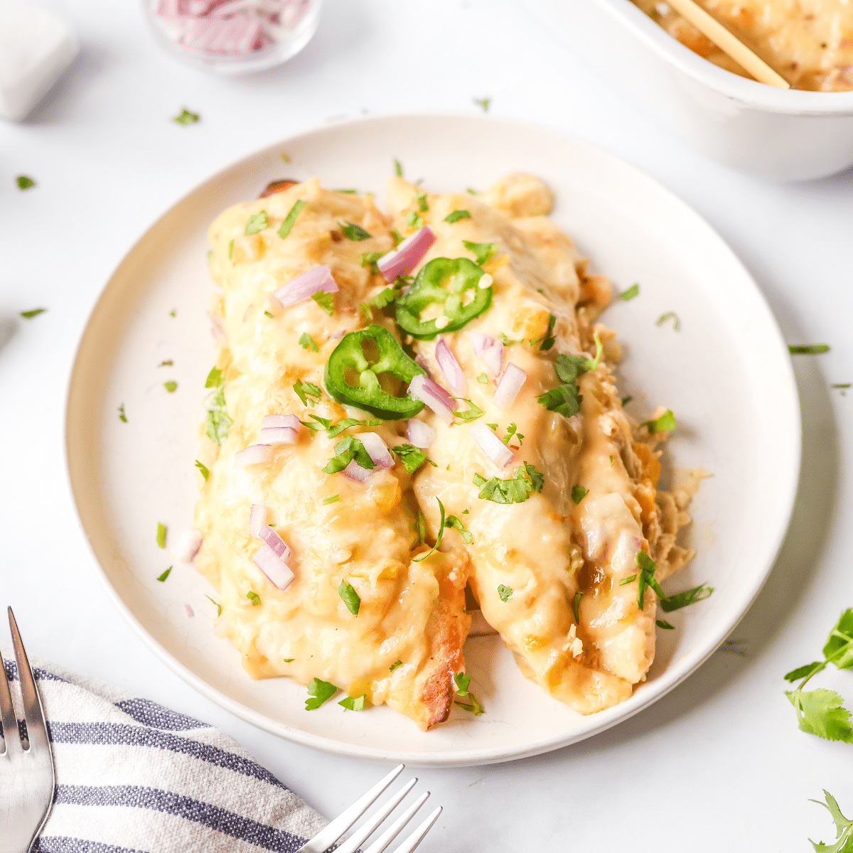 Green chile chicken enchiladas plated