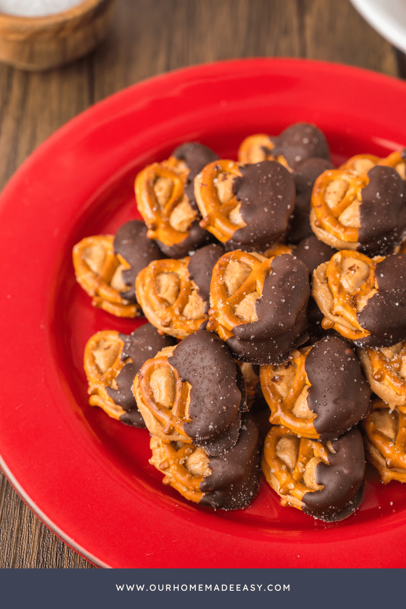 close up of peanut butter pretzels on red plate