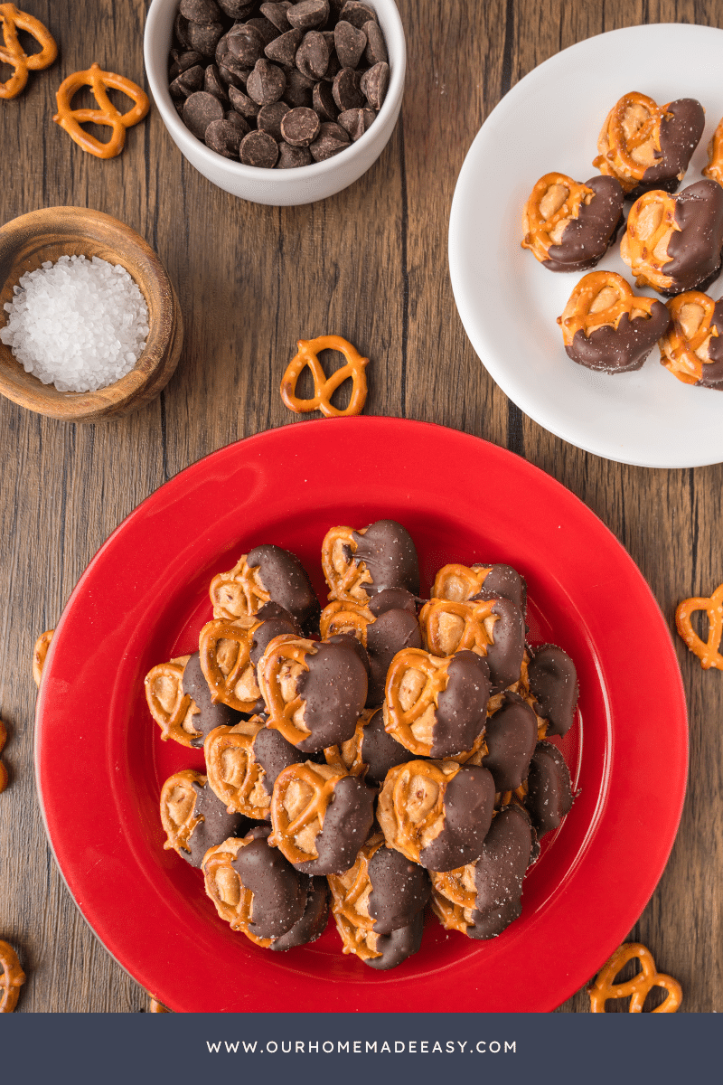 looking down at chocolate covered pretzels on red plate