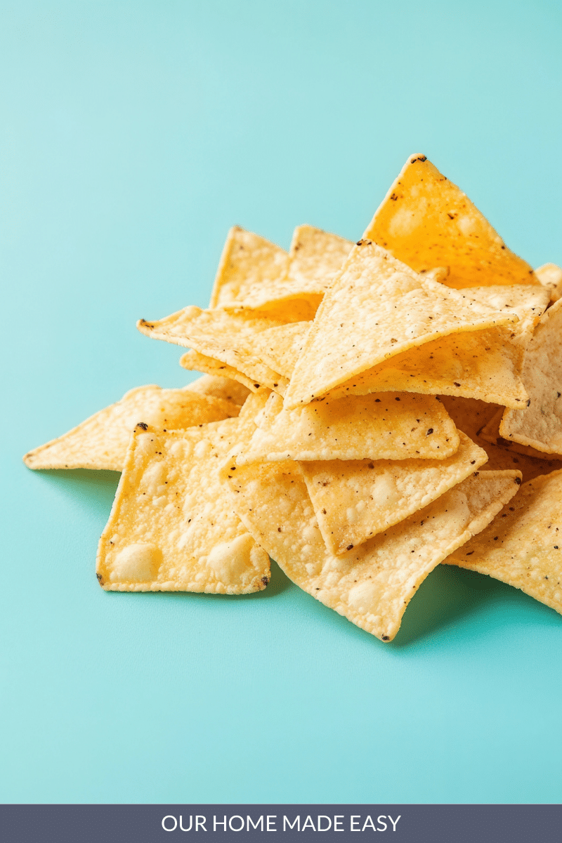 stack of tortilla chips on aqua surface